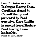 Text Box: Leo C. Beebe receives Terlingua Racing Team Certificate signed by Carroll Shelby and presented by Ford executive, Dave Crellin, in recognition of Beebes Ford Racing Team leadership. Photo by Bob Jackson